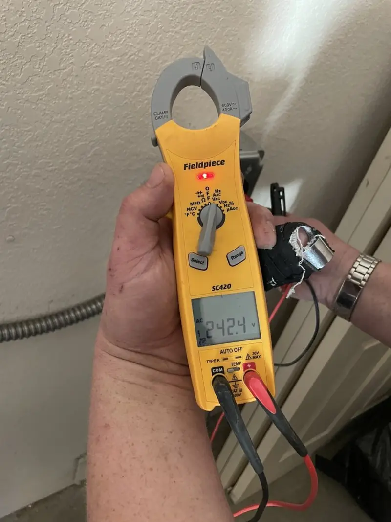 Voltage testing with clamp meter during Electrical Installation Services in Glenburn